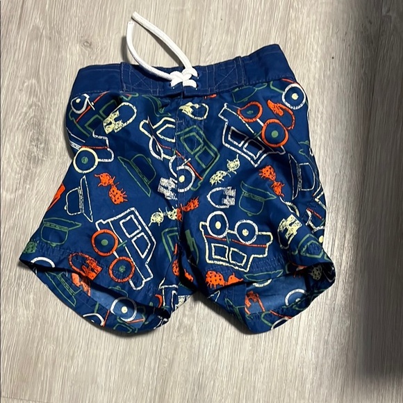 4/$20 Kids Blue Swim Shorts with Colorful Vehicle Print - Picture 1 of 1